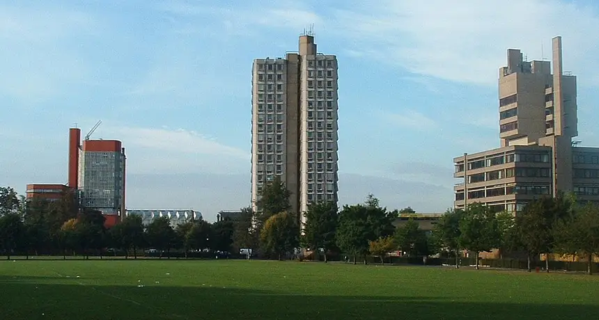 The University of Leicester campus seen across open parkland, with its tower block at the centre